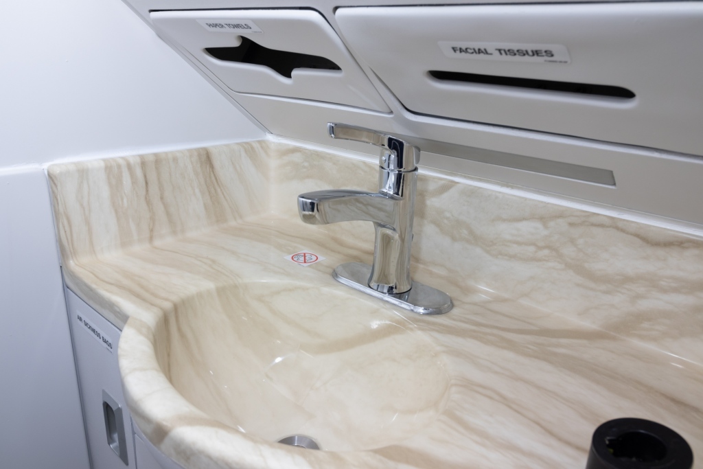 Interior regional aircraft conversion on Embraer aircraft - photo of aircraft lavoritory sink and cabinets