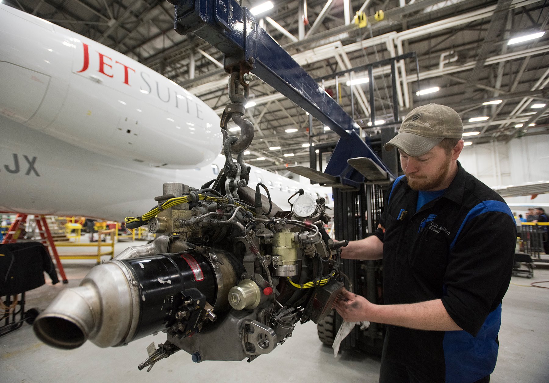 Interior Regional Aircraft Conversion On Embraer Aircraft - Photo Of A  Technician Working On An Aircraft Engine - C&L Aero