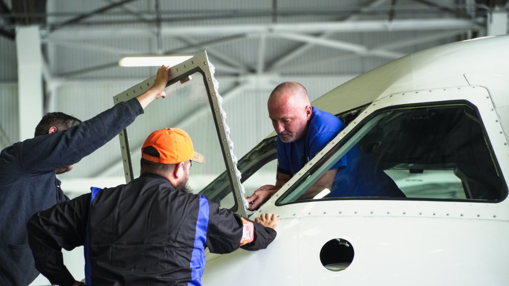 Aircraft Windshield Damage (Mechanics replacing an aircraft windshield) 