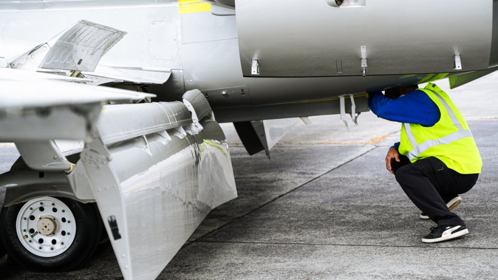 AOG Part Support: Aircraft Technician inspects a grounded aircraft 