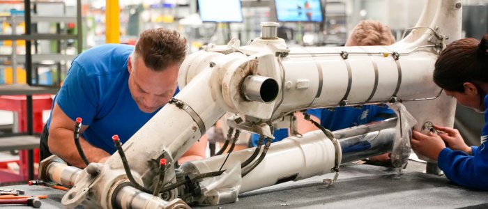 Technicians performing a landing gear overhaul